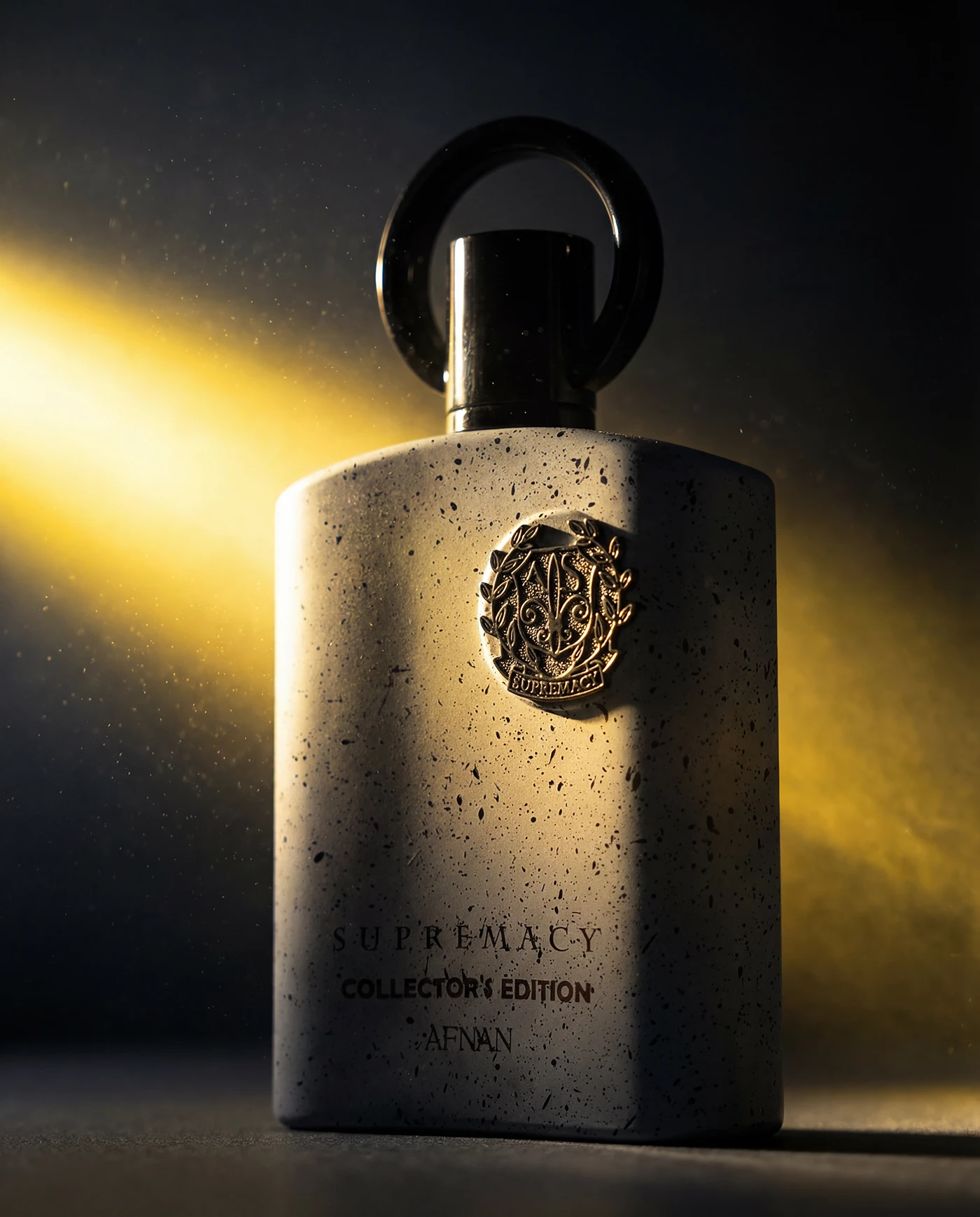 The Supremacy Collector's Edition bottle alone under a beam of warm light